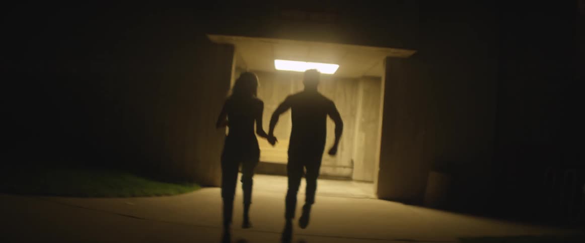 Man and woman holding hands and running