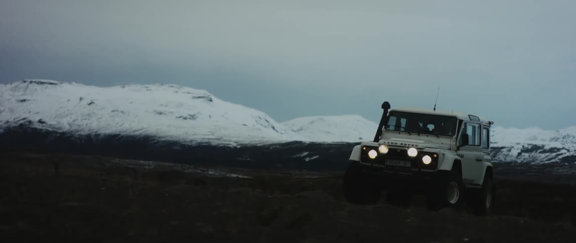 A man is driving a jeep in the wilderness