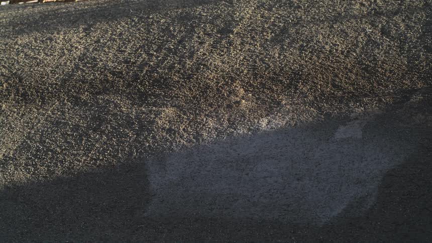 Shadow covers part of textured surface