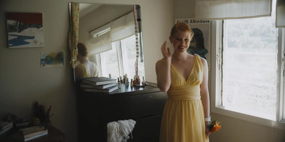 A woman shows off her new yellow dress