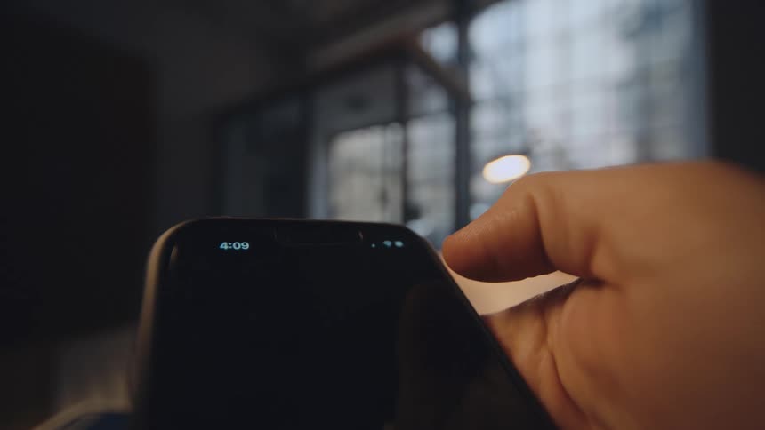 pov of thumb slides a button on a smart phone screen
