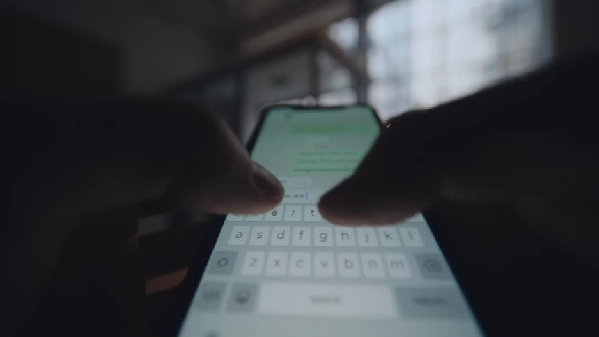pov close up of smartphone screen while person is text messaging