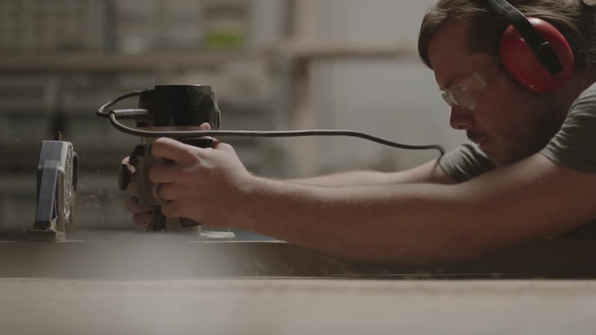 Person using power equipment in his workshop