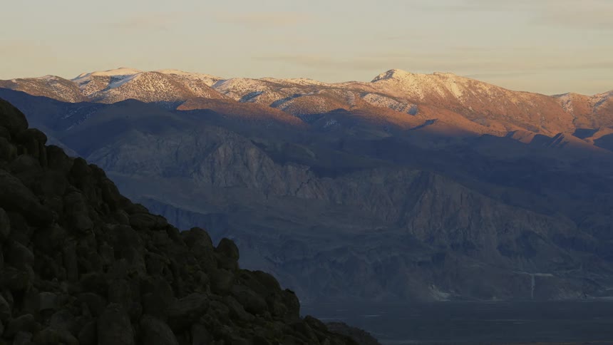 The mountain range is covered in shadow