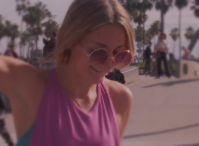 A woman is dancing in the park