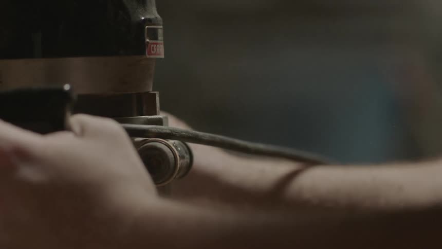 Person using a power tool indoors