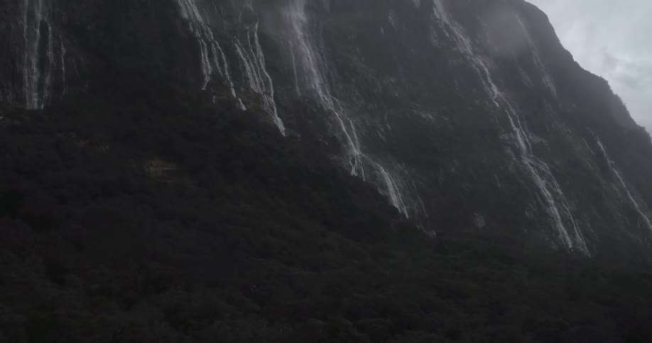 Aerial view of a mountain with water pouring down its sides