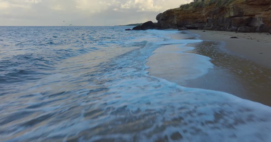 Ocean waves wash onto the beach
