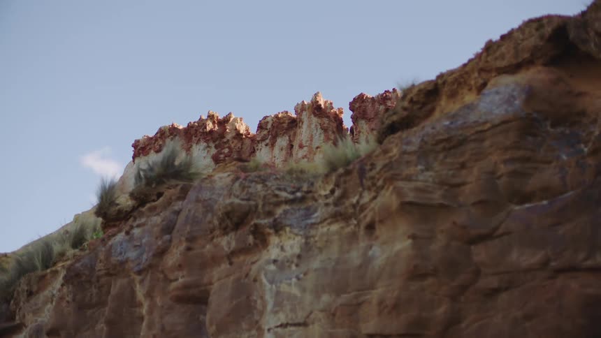 Natural cracks form on the top of a canyon