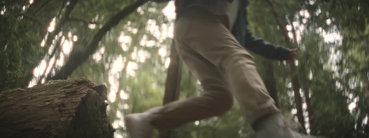 A person jumping in a forest