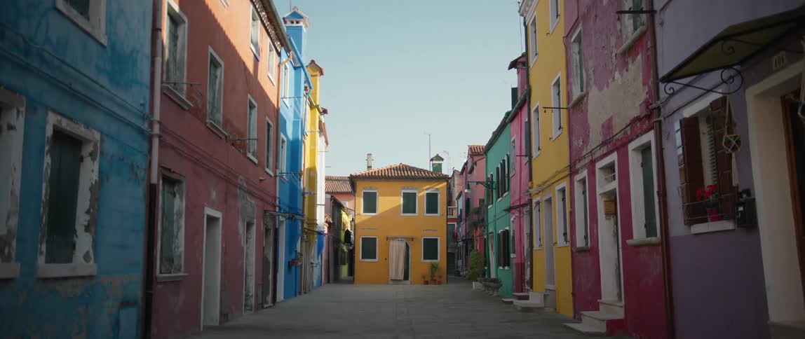 A quiet road with colorful houses on Burano Island, Venice, Italy