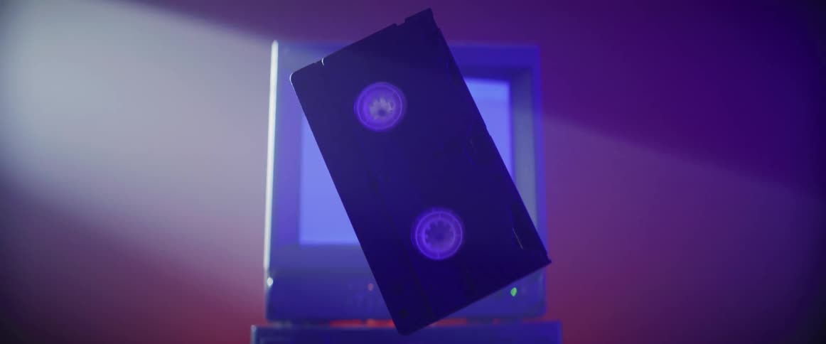 A view of a vhs tape in front of a tv