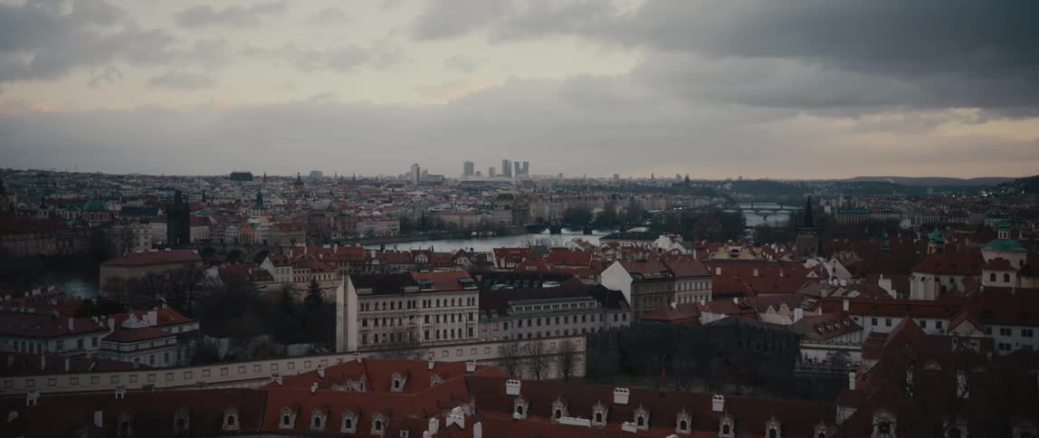 View of Prague and the Vltava River from an elevated location on a cloudy day