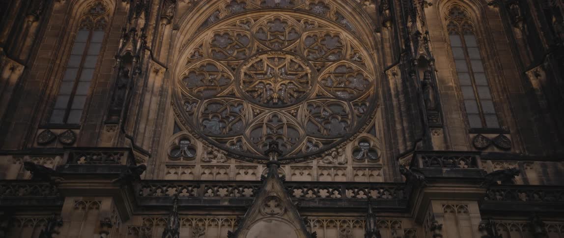 View panning down from the Gothic spires to the front facade and entrance doors of Saint Vitus Cathedral in Prague Castle Complex, Czech Republic