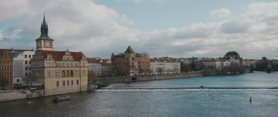 View of Old Town Prague, Czech Republic, from Charles Bridge over the River Vltava, including Bedrich Smetana Museum and Old Town Water Tower.