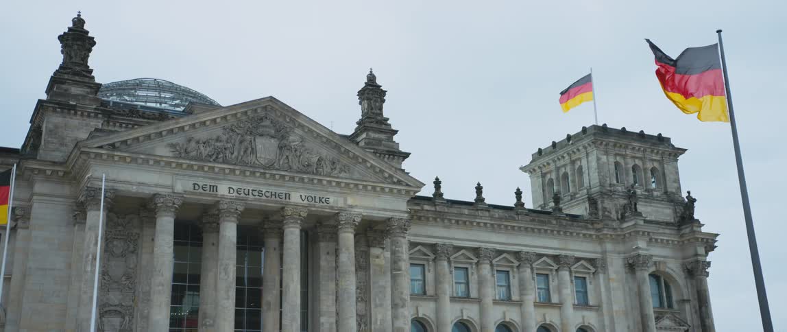 View of the ornate columned entrance of the Reichstag parliament building in Berlin, Germany