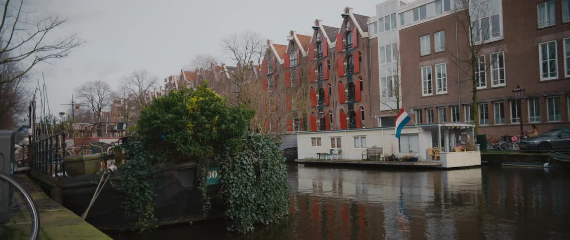 A houseboat flies the Dutch flag in Amsterdam