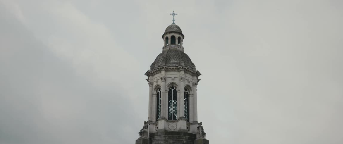 The dome, lantern, and gilded cross atop the belfry of the Trinity College Campanile in Dublin, Ireland