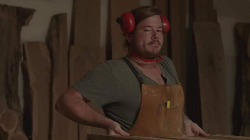 Man adjusting his workspace in a workshop