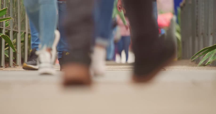 People walking down a city sidewalk
