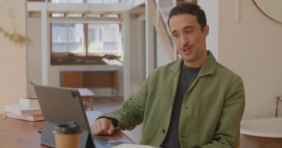 A man talking on a tablet
