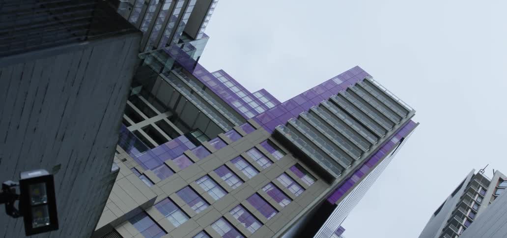 City with office buildings and skyscrapers against the cloudy sky