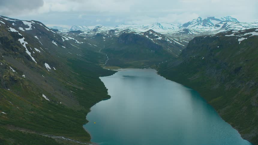 An aerial view of a river running through a mountain range