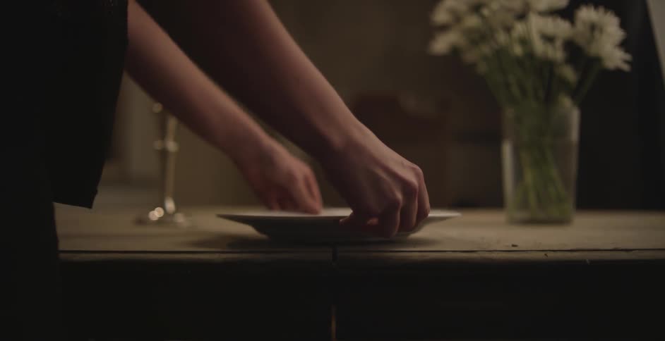 Person setting a table