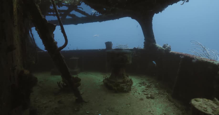 Deck of a sunken ship in the blue clear ocean water