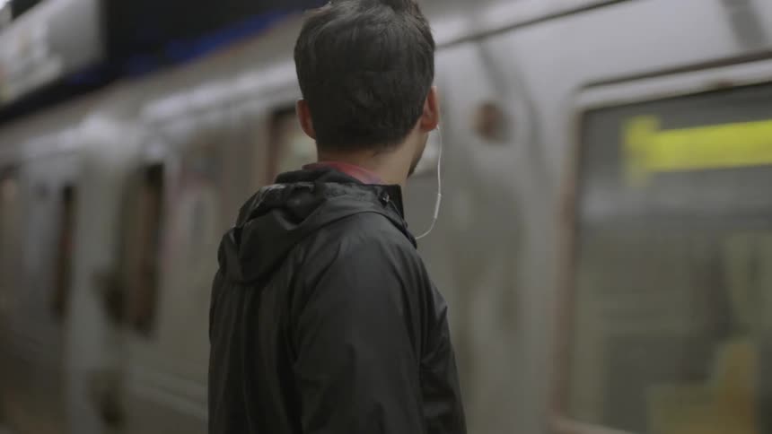 A man is waiting for a train