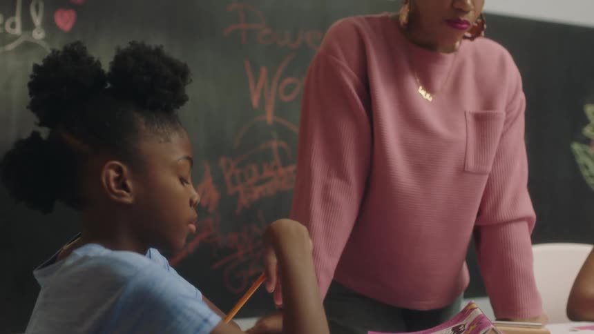 A teacher is talking to a student