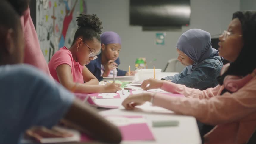 A teacher is talking to her students