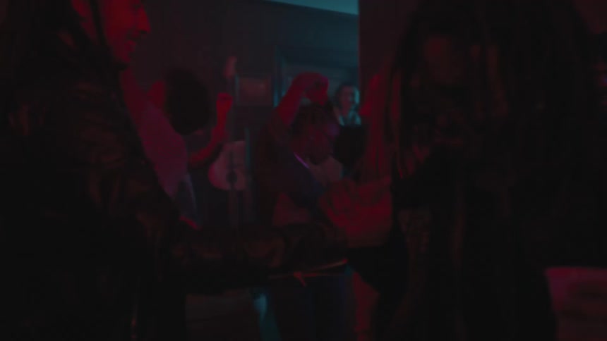 People are dancing and drinking in the party