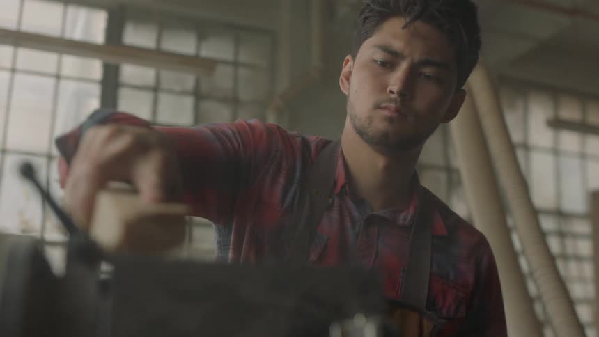 Man using a belt sander