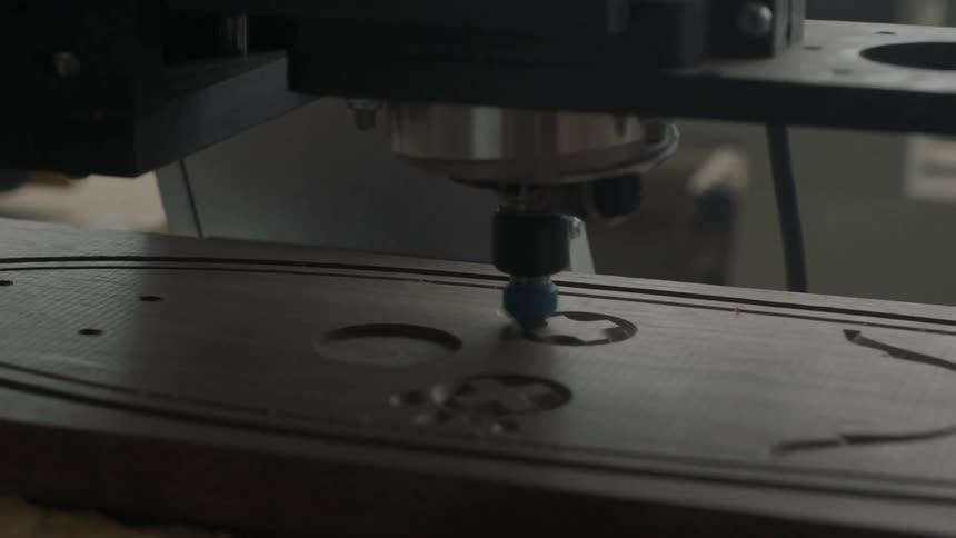Machine carving a design into wood
