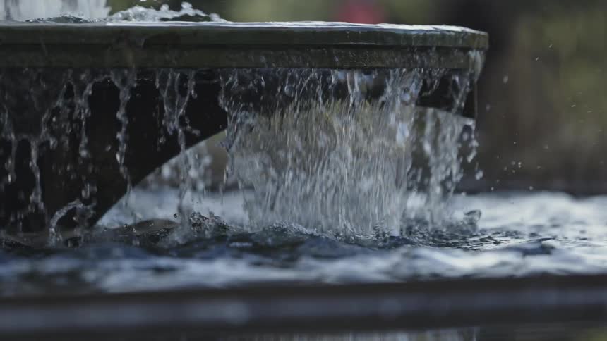 Water spills between sections in a water fountain