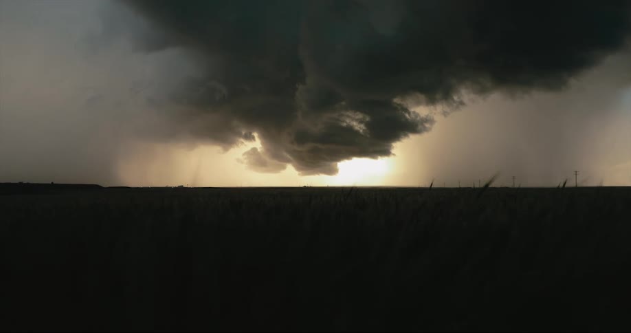 Dark clouds form over a field