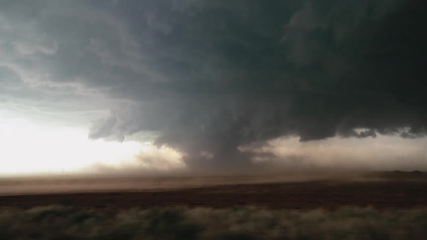 Dark storm clouds over a field