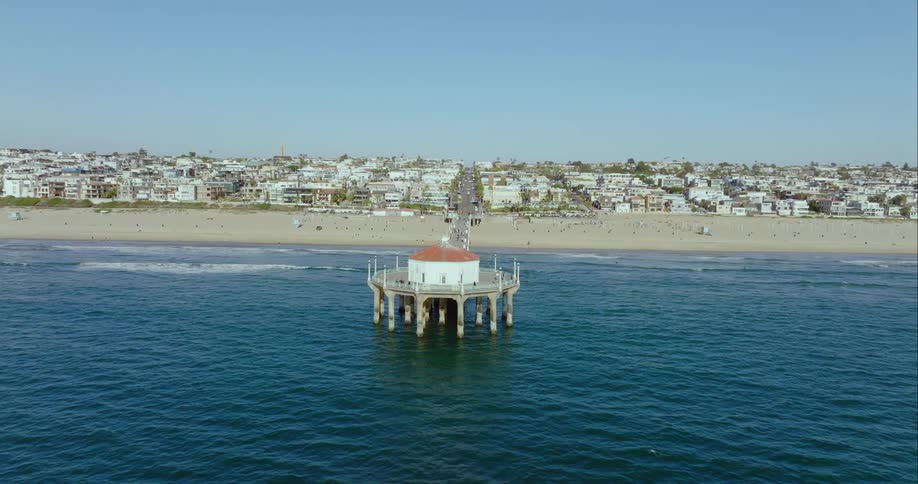Aerial view of ocean water near the beach is displayed