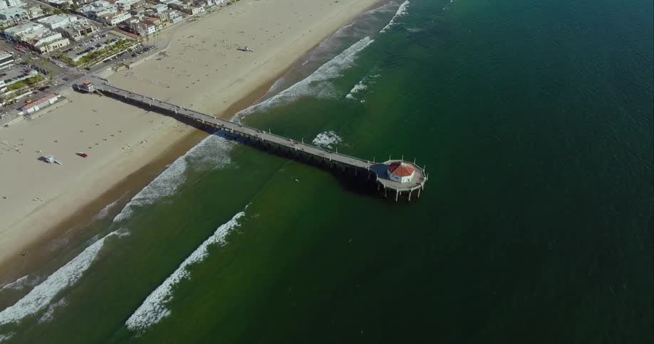 A long pier that has a single rounded building atop it at the very end