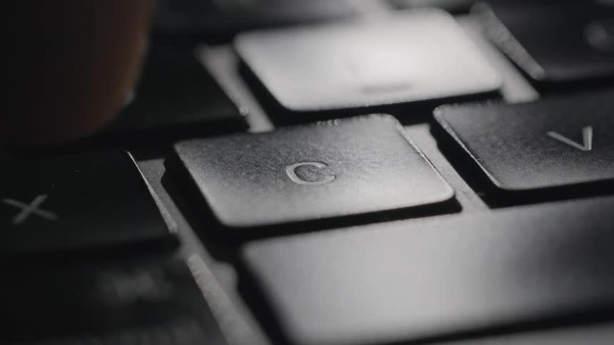 A view of a key touching a keyboard