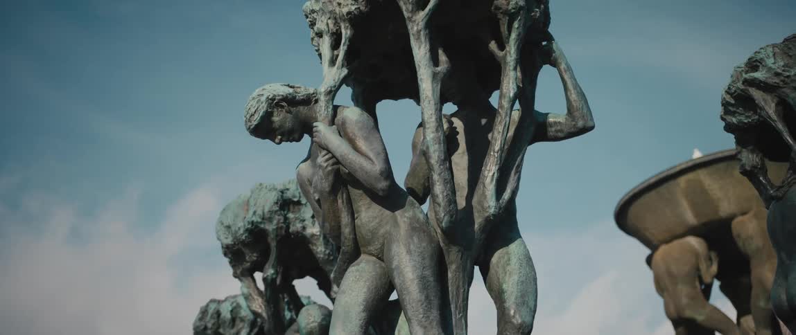 Close up view of one of many tree sculptures surrounding The Fountain in the Vigeland sculpture installation at Frogner Park, Oslo, Norway.