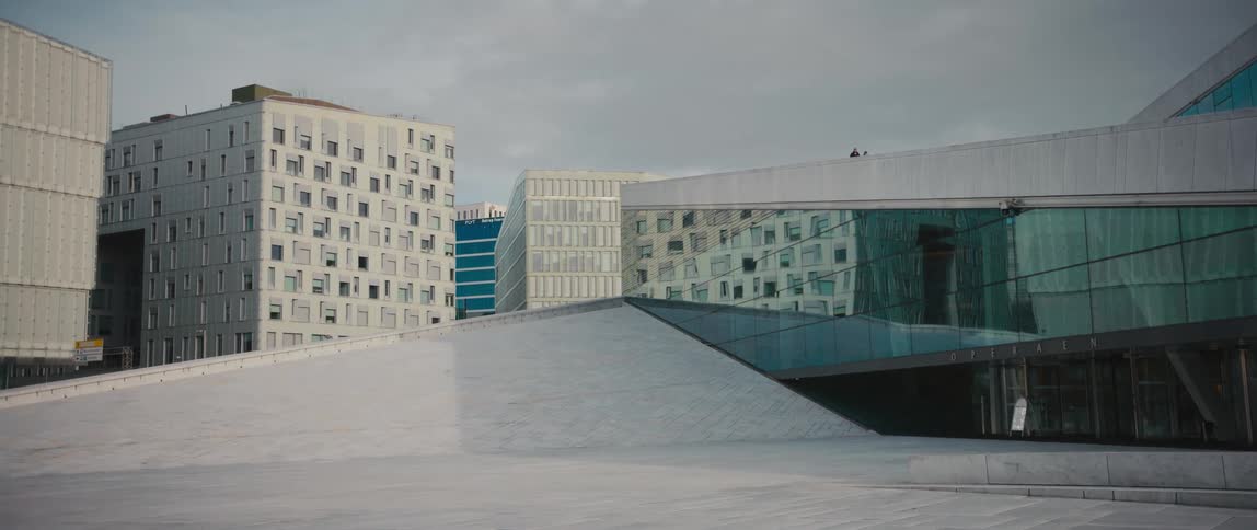 Side view of the reflective mirrored windows of Oslo Opera House, Operahuset, in Norway at the head of the Oslofjord.