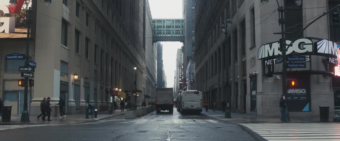 People walk and drive in the city