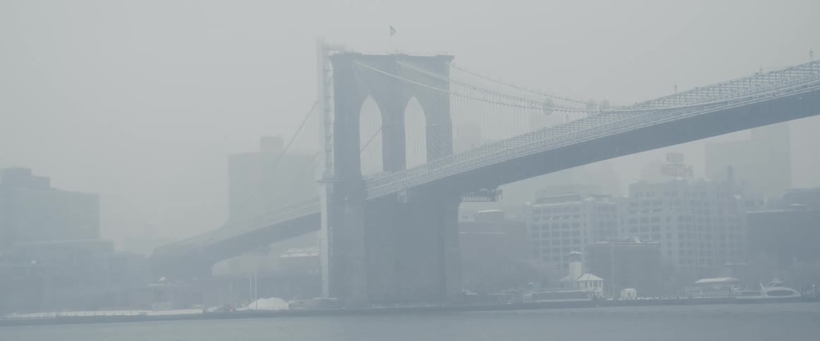 A large bridge leads to the city