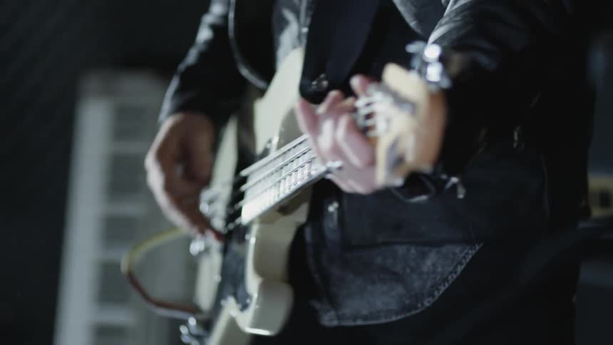 Person playing a guitar