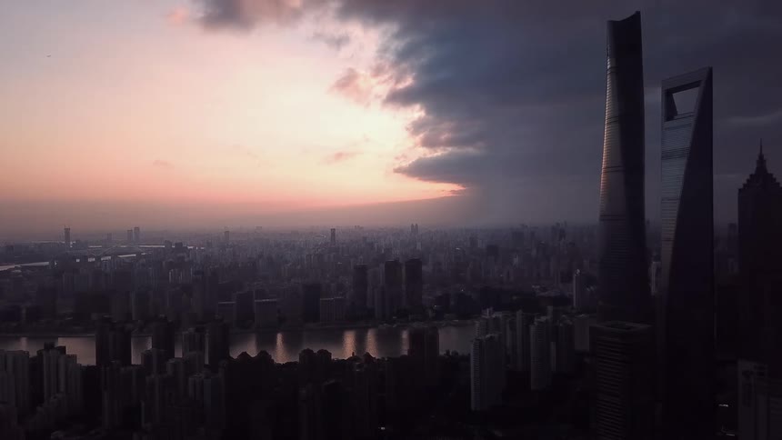 The shanghai china city skyline including the shanghai world financial center at sunset