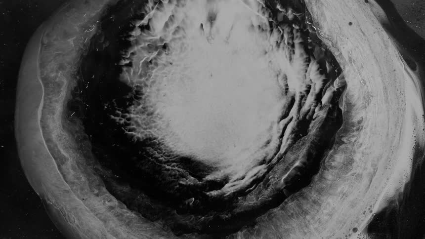 Flowing black and white liquid