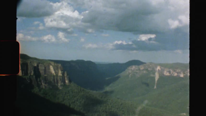 Mist fills the valley nearest the horizon as remaining forest covered mountains and valleys remain clearer