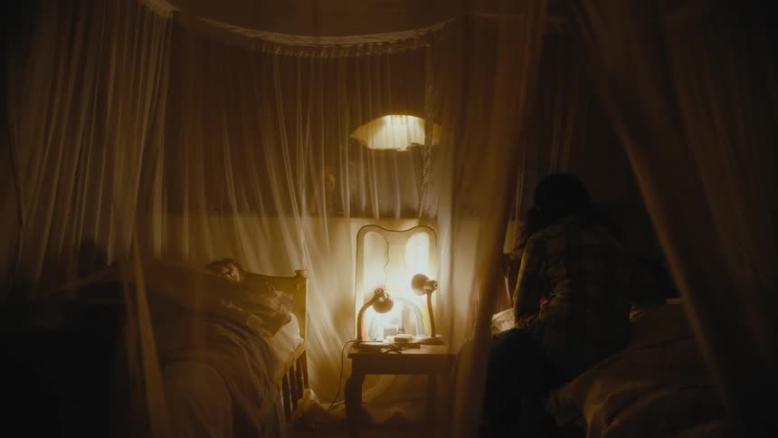 A woman and child go to bed